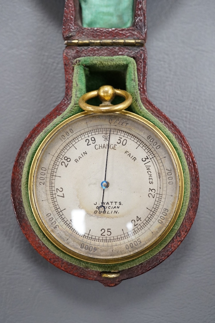 A pocket aneroid barometer by J. Watts, Optician, Dublin, in a fitted leather case with a label for ‘T. Mason, Optician, 5, Dame Street, Dublin’, to the inside of the lid.